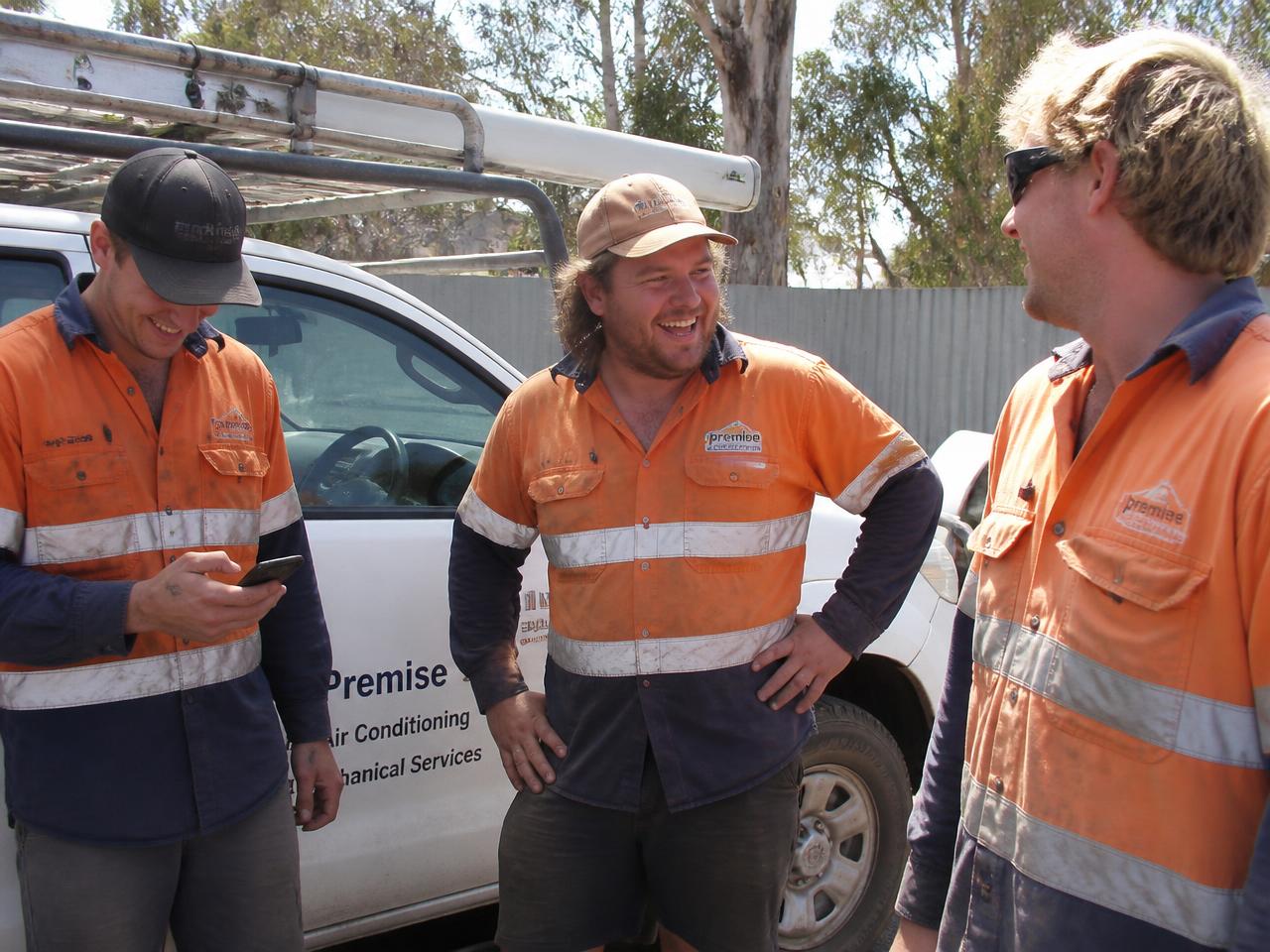 Local tradesmen in hi-vis shirts on a Queensland job site